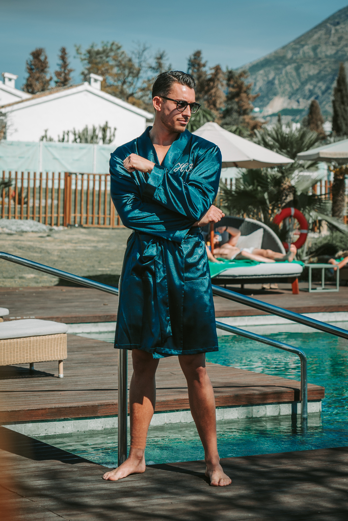 Man in kimono near the swimming pool