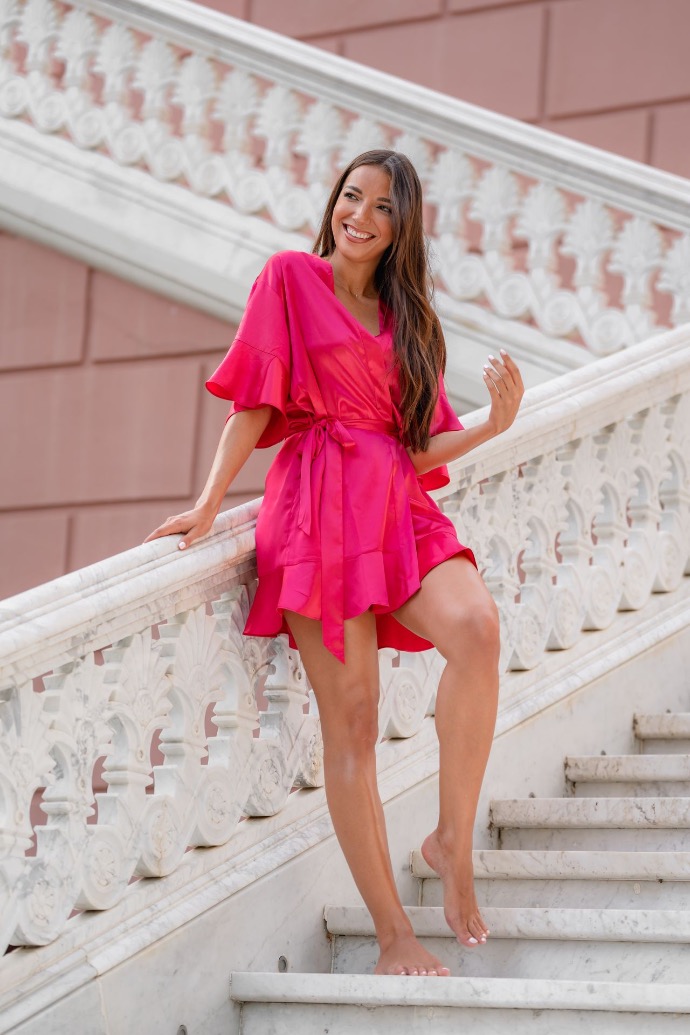 Woman in kimono smiling in the stairs